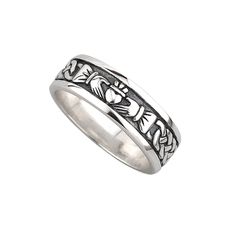 PRICES MAY VARY. This striking sterling silver ring for gentlemen is made from oxidised silver giving it a contemporary “blackened” look. Features the Claddagh at the centre of the band, an emblem of love and eternal devotion with its symbols representing love (heart), friendship (hands) and loyalty (crown). This oxidised Claddagh ring has been Irish hallmarked in Dublin Castle. 925 Sterling Silver; Ring height: 7 mm (0.3 in); Weight 7.6 grams Biddy Murphy Irish Gifts sells authentic Irish goods Friendship Hands, Claddagh Wedding Ring, Mens Claddagh Ring, Claddagh Ring Wedding, Celtic Band, Silver Claddagh Ring, Groom Ring, Dublin Castle, Irish Claddagh