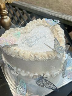 there is a cake with butterflies on it