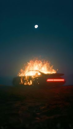 a car on fire with the moon in the background