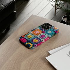 a cell phone case sitting on top of a wooden table