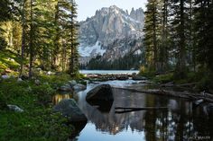 a mountain lake surrounded by trees and rocks