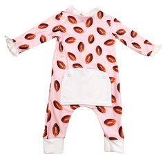 Score a touchdown with these Buttflap Pajamas! These football-themed pajamas for boys will have your little one ready for game day (and bedtime) in style. Made of soft and cozy material, these pajamas are perfect for snuggling up and dreaming of touchdowns. Go team! 95% Polyester 5% Spandex True To Size Bodysuit: Sizes Newborn to 12m Two Piece Pant Set: Sizes 18m to 12y Elastic waistband Sewn on buttflap Buttflap Pajamas, Family Football, Girls Football, Autumn Sales, Boys Pajamas, Halloween Sale, Play Hard, Girls Pajamas