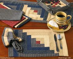 quilted placemats and napkins on a table with a cup of coffee