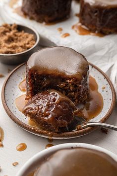 a piece of chocolate cake on a plate with caramel sauce drizzled over it