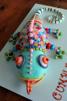 a birthday cake decorated with candy and decorations