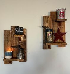 two wooden shelves with teapots and candles on them