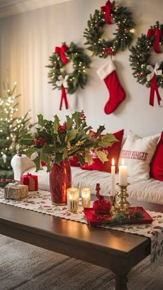 a living room filled with christmas decorations and candles