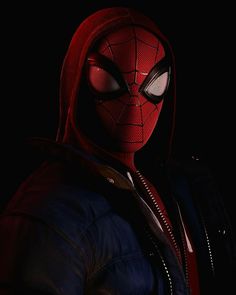 the spider - man is wearing a red hoodie and black jacket with his eyes closed