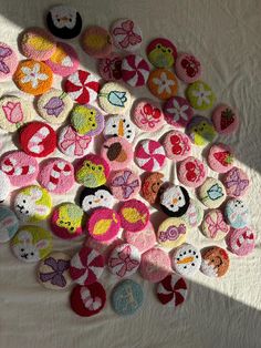 a pile of crocheted buttons sitting on top of a bed