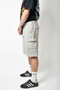 🚀Need to get your order super fast? Choose DHL Express shipping upgrade in your cart. It takes only 1-2 b. days to European Union countries and 2-5 b. days to USA, Canada and all other countries. Orders are ready to ship in 1 b. day. 🔥Multi pocket cargo Y2K men's long shorts in beige/grey colour. Size - M (33). Model is 177 cm / 5ft 9.6" tall and usually wears size M. Very good vintage condition. Only 1 available! All orders are shipped every day Worldwide from 🇪🇺EU. Safe registered standard Gray Cargo Shorts With Pockets For Outdoor, Gray Cargo Shorts With Pockets For Outdoor Activities, Beige Cargo Shorts For Outdoor, Gray Cotton Shorts For Outdoor Activities, Summer Cargo Shorts With Multiple Pockets For Outdoor Activities, Beige Summer Cargo Pants For Outdoor Activities, Beige Shorts With Pockets For Outdoor Activities, Gray Cargo Pocket Shorts For Streetwear, Gray Cargo Shorts For Summer