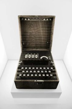 an old fashioned typewriter sitting on top of a table