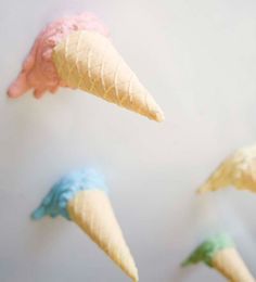 four ice cream cones with different colors on them