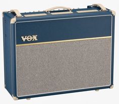 a blue and gray amp with gold lettering on the front, sitting upright against a white background