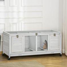 a white cabinet with two doors and a cat in it