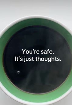 a coffee cup with the words, you're safe it's just thoughts