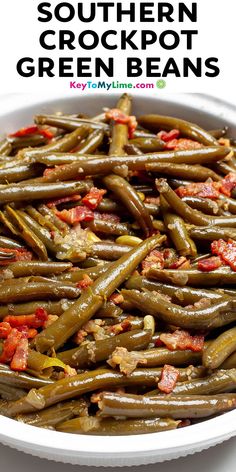 southern crockpot green beans in a white bowl with bacon on top and text overlay