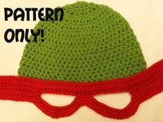 a crocheted green hat with red glasses