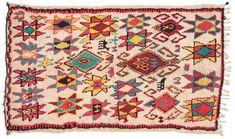 an old rug with many different colors and designs