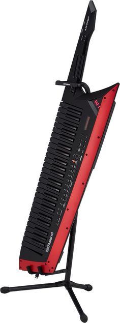 an electronic keyboard sitting on top of a stand