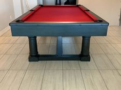 a pool table with red cloth on it