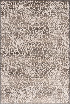 an animal print rug with brown and white colors