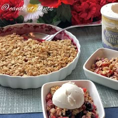 three bowls filled with fruit and ice cream on top of a table next to flowers