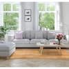 a living room filled with white furniture and lots of window sill space in front of it