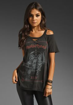 a woman wearing black leggings and a t - shirt with an image of a skeleton