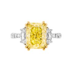 3 stone ring in Platinum & 18k Yellow Gold; Center: 4.30ct Natural Fancy Yellow Even VS1 Radiant Shape Diamond GIA#2225380820 Side stones: 0.71tcw Cadillacs D VS White stones Total Carat Weight: 0.33ct Yellow stones Total Carat Weight: 0.02ct Total Carat Weight pave: 0.35ct Size: 6 Retail value: $160,000 Canary Diamond Ring, Cushion Diamond Ring, Canary Diamond, Brilliant Cut Diamond Ring, 3 Stone Ring, Elongated Cushion, Diamond Cluster Earrings, Yellow Diamond Rings, Fancy Yellow Diamond