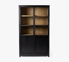 a black bookcase with wooden shelves and glass doors on the front, against a white background