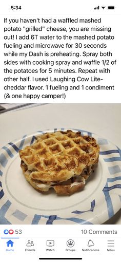 a white plate topped with a waffle on top of a blue and white table cloth