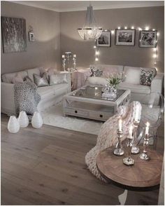 a living room filled with lots of white furniture