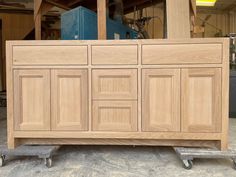 a large wooden cabinet sitting on top of a dolly