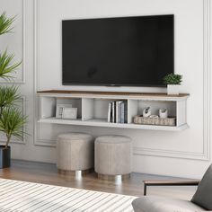 a flat screen tv mounted to the side of a wall