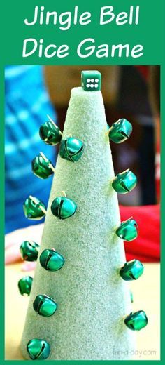 a christmas tree made out of green glass beads with the words jungle bell dice game on it