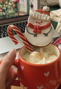 a cup filled with hot chocolate and marshmallows