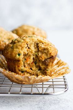 muffins on a cooling rack with one cut in half