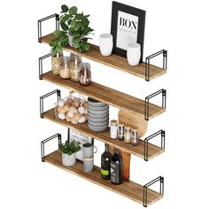 three wooden shelves with pots, plates and other items on them in front of a white background