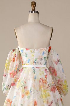 a white dress with colorful flowers on it