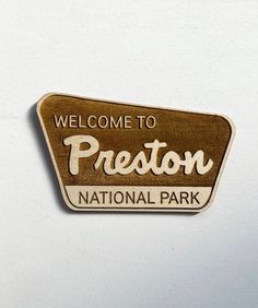 a wooden sign that says, welcome to preston national park