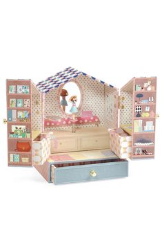 an open doll house with furniture and accessories