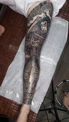 a man with a tattoo on his leg