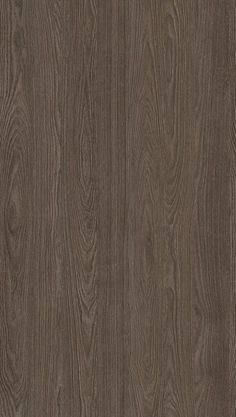 the wood grained surface is dark brown and has been used as a background or wallpaper