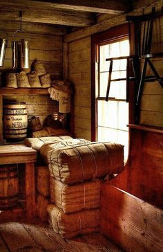 an old fashioned kitchen with wooden floors and walls