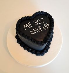 a heart shaped cake with the words me 30 shot up on it's side