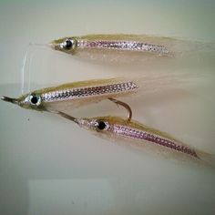 two lures are shown on a white surface