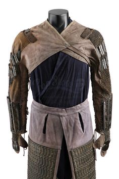 the back of a man's costume with armor on it