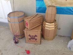 cardboard boxes are stacked on the floor next to balloons and other items that have been placed around them