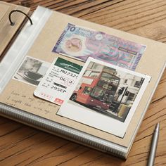 an open book on a wooden table with money