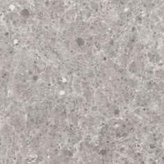 a close up view of the surface of a marbled floor with grey and white speckles